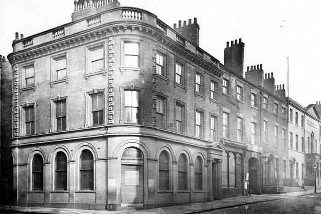 Albion Street, west side showing junction with Bond Street. Gated entrances to Yorkshire Post Offices on the right.