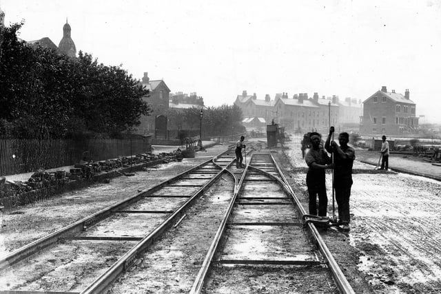 Tram lines being laid in Roundhay Road, near to the junction with Gathorne Street. This tramway would have formed part of the line from Sheepscar to Oakwood, on which the first steam powered trams in Leeds operated from May 1891.