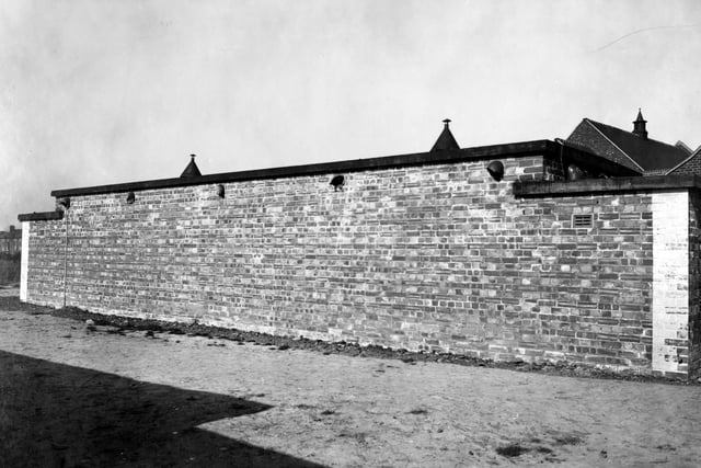 Osmondthorpe Public Cleansing Centre. A view of public washroom, showing flat roofed brick building. Photo has been taken to show damage.