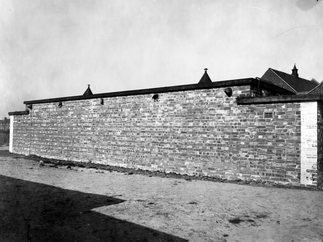 Osmondthorpe Public Cleansing Centre. A view of public washroom, showing flat roofed brick building. Photo has been taken to show damage.