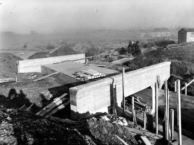 This photo shows the bridge under construction over Wyke Beck. The concrete sides have been put in place and the floor has been layed.