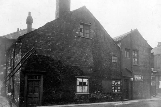 Off Spence Lane, junction with Wortley Lane. Listed as number 3 Wortley Lane and rear of premises in Barratt Fold, G. Clarkson Ltd, chemists.