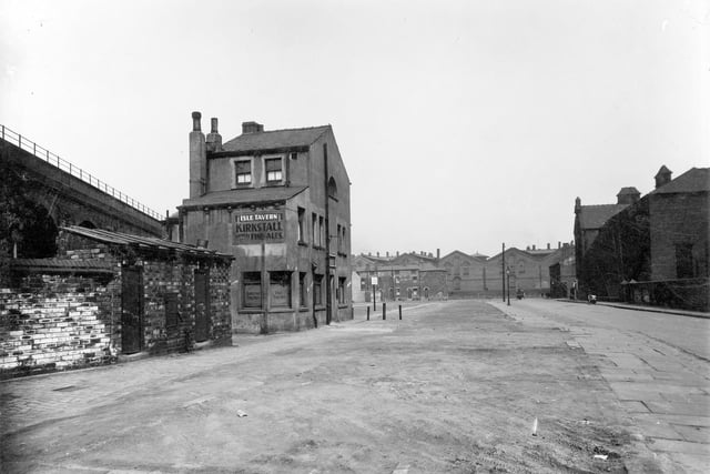 This view is taken from the partially demolished Front Walk and the vacant land that was Czar Street. On left hand side of Front Walk is The Isle Tavern public house, a three storey building which was owned by Kirkstall Brewery.