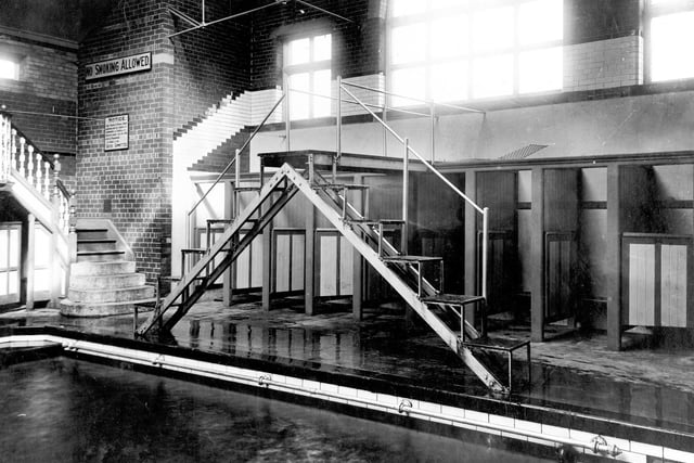 Located on Holbeck Lane, the baths were opened in 1898 and closed in 1979. This view shows the swimming pool with diving platform. To the left, steps leading to a spectators balcony with changing cubicles underneath.