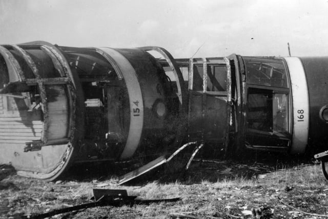 A view showing overturned tram cars at Low Fields Scrapyard.