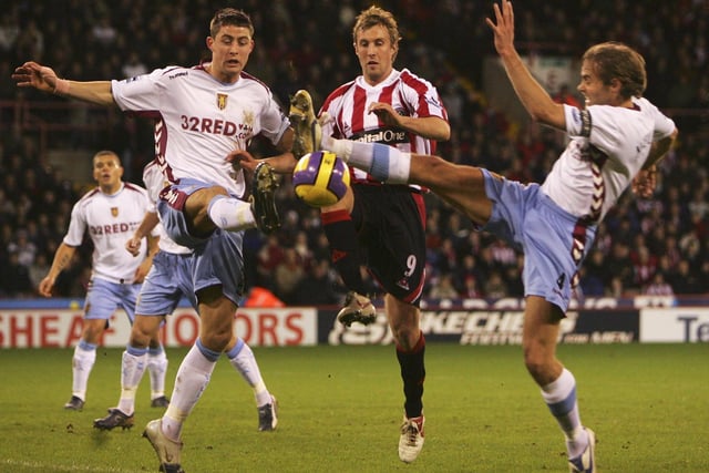 Gary Cahill (L) and Olof Mellberg battle for the with Rob Hulse during the Barclays Premiership match between Sheffield United and Aston Villa at Bramall Lane on December 11, 2006 in Sheffield, England. (Photo by Laurence Griffiths/Getty Images)