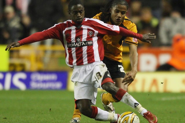 Michael Mancienne (R) tackles Nathan Dyer during the Championship match between Wolverhampton Wanderers and Sheffield United at Molineux Stadium on December 26, 2008 in Wolverhampton, England. (Photo by David Rogers/Getty Images)