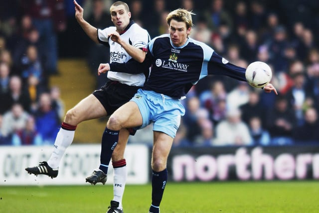Gareth Taylor of Burnley tries to shield the ball from Andy Melville of Fulham during the FA Cup fifth round match held on February 16, 2003 at Loftus Road, in London. The match ended in a 1-1 draw. (Photo by Jamie McDonald/Getty Images)