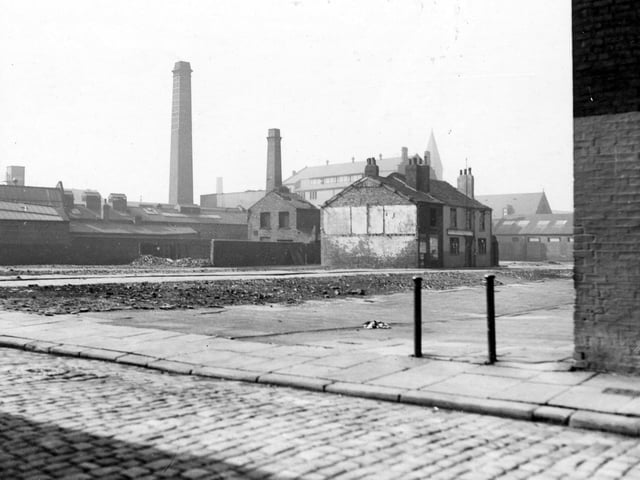 Photo taken from behind Carpenters Arms on Stone Row, showing housing clearance on Camp Fields. It shows the Bricklayers pub on Middle Row and the Victoria Wheel and Wagon works in the background with St. Francis of Assisi school.
