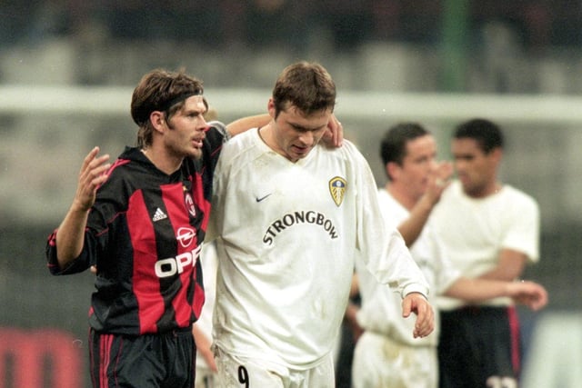 Zvonimir Boban shares a story with Mark Viduka at full time.
