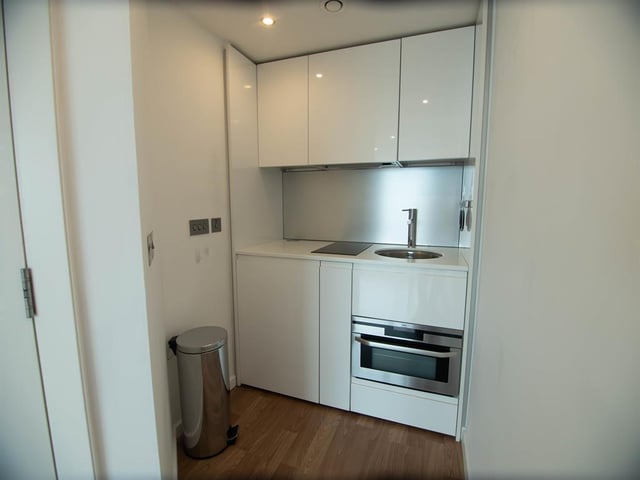 The kitchen can be described as very "cosy" but it has enough space to prepare food and a built in fridge, sink and oven.