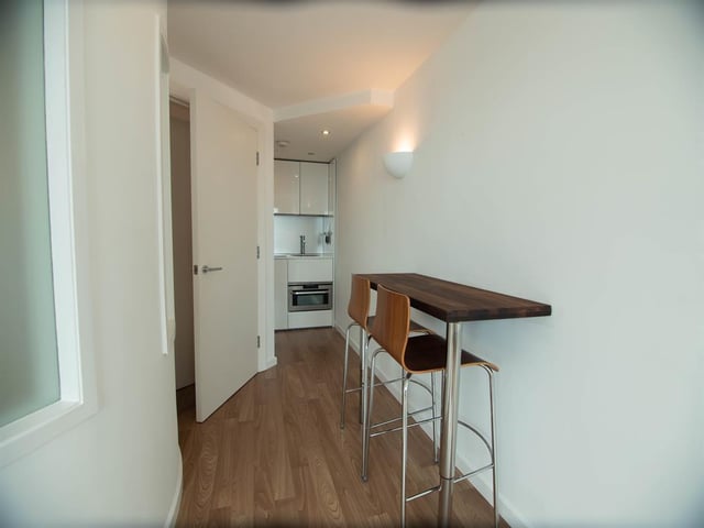 The dining area is a small breakfast bar worktop located near to the kitchen.