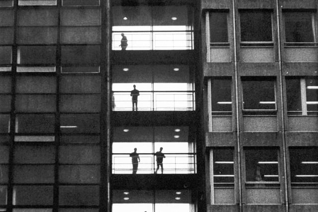 Striking study in sillouettes is provided by students of Leeds College of Technology as they pause on landings between adjoining buildings in March 1968.