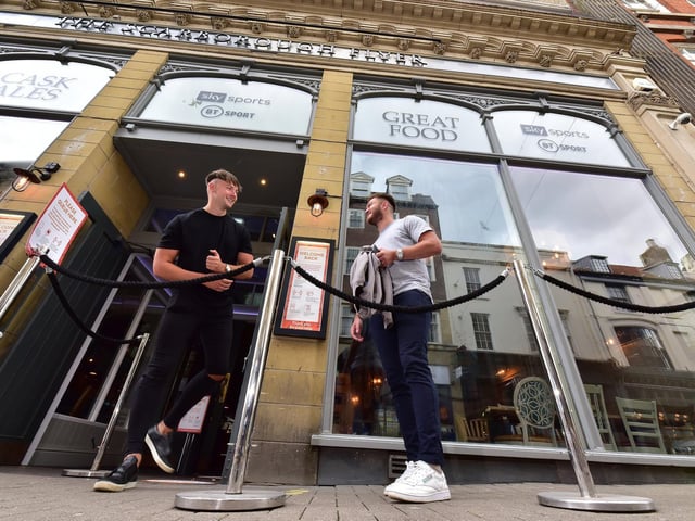 Friends await their turn for admission into The Scarborough Flyer, in St Nicholas Street.