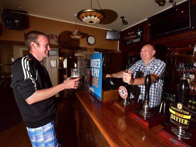 The Albert Pub in North Marine Road opens with Ben Schofield having a pint and Michael Hirst serving.