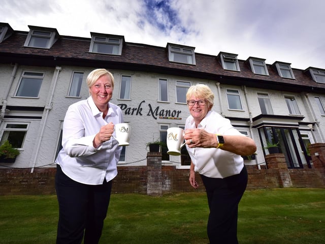 Making a toast with tea ... Park Manor Hotel staff Mags McNaught and Ali Lockwood celebrate.