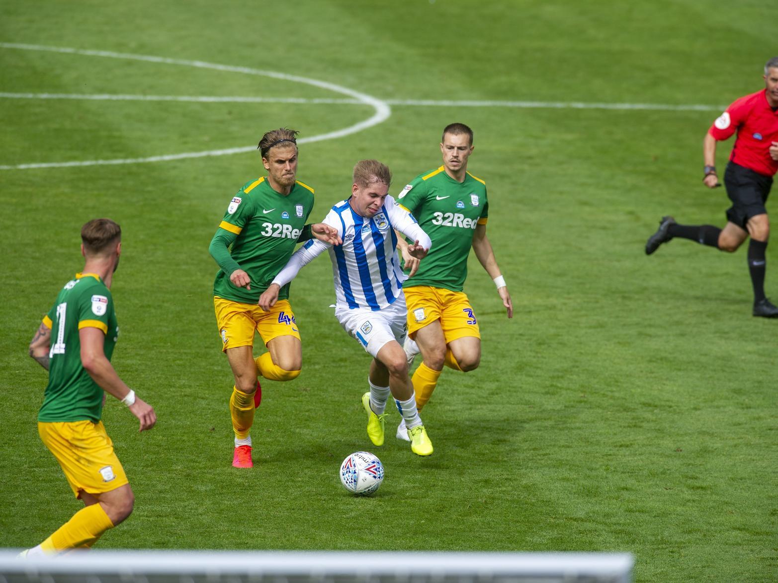 Brad Potts checks the run of Huddersfield substitute Emile Smith Rowe