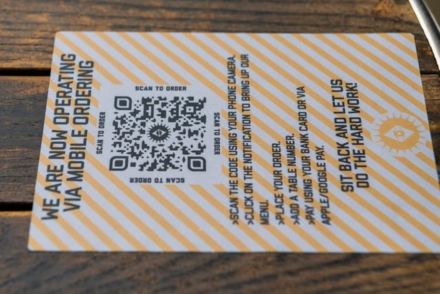A scan code on a table at The Brotherhood bar, New Briggate, Leeds, to order drinks in readiness for the venue to reopen for customers.