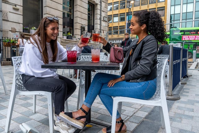Two friends Hannah Smith, 19, and Sophia Scott, 18, enjoying a drink together outside Wetherspoon 'Becketts Bank', Greek Street, Leeds.