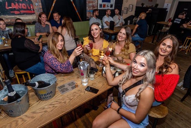 A group of friends (left to right) Laura Bruin, Rachel Bean, Emily Shaw, Hannah Cressey and Georgia Jackson, celebrating the reopening of bars and pubs whilst in The Brotherhood, New Briggate, Leeds.