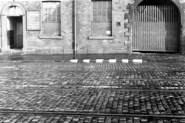 Tram tracks, taken during the Second World War on Richardshaw Lane. In the background is a mill manufacturing cloth.