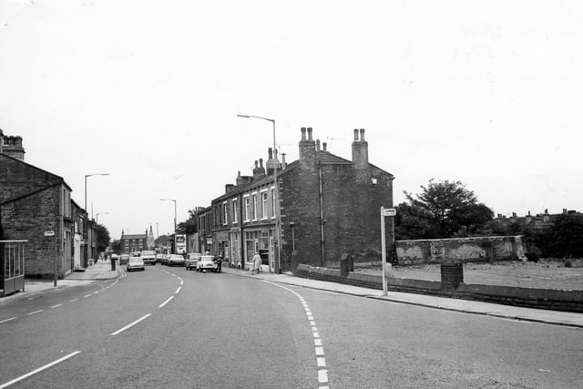 Chapeltown looking from the junction with Uppermoor and Greenside. Greenside is off to the right. The wall on the right is the boundary of the site of the demolished Pudsey Congregational Church. It was demolished in 1978.