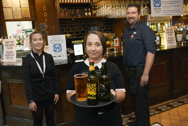 from left, Isabel Barnes, Amanda Campbell and Dave Higham staff  at The Moon Under Water, Wetherspoon pub, Wigan.