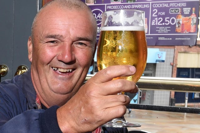 Paddy Jones enjoys a pint at The Moon Under Water, Wetherspoon pub, Wigan.