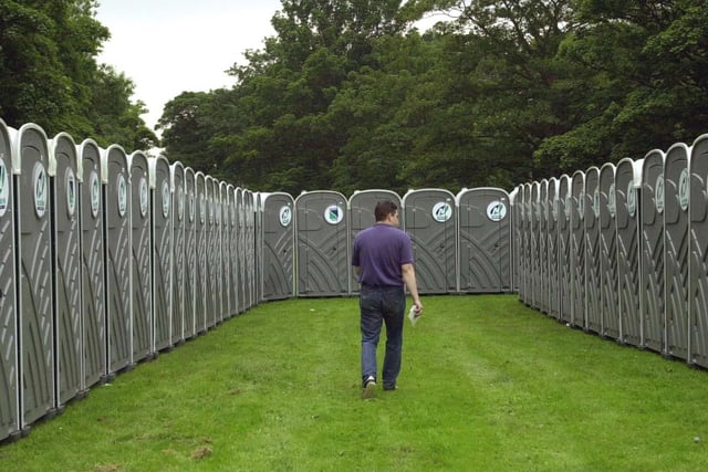 A wokeman checks the hundreds of portable toilets ahead of the start of the event.