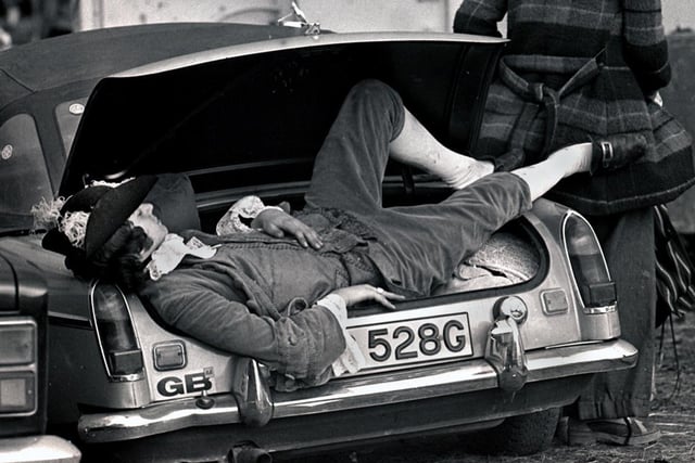 A music fan takes a snooze in his car boot at the Bickershaw Festival in 1972.