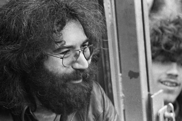 Lead guitarist for American rock band the "Grateful Dead" Jerry Garcia, chats to fans backstage after the group's marathon session at Bickershaw Festival in 1972