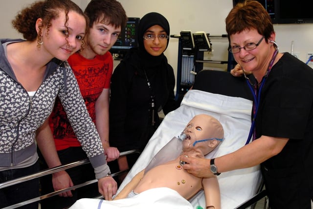 Year 12 students from Cardinal Newman, Runshaw and Preston College joined a three-day simulation seminar at Royal Preston Hospital. Pictured: Lucy Carroll, James Ashworth- Holland and Safiah Casooji from Cardinal Newman get a few pointers from Jacky Harrison. Jacky is the Simulator Clinical Lead for the undergraduate department and consultant in Emergency Medication at Lancashire Teaching Hospitals