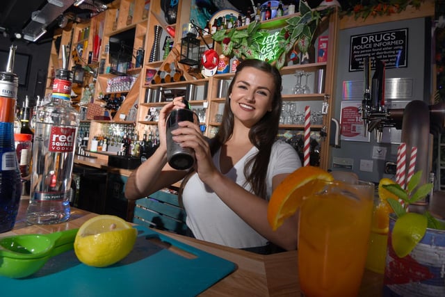 Stephanie Carr behind the bar at Asylum, a new bar open in Standish.