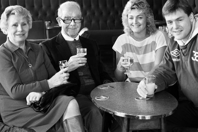 Retired miner's leader Joe Gormley in the Plough and Harrow pub in Shevington with wife Nellie and grandchildren Joy and Ian in November 1986.