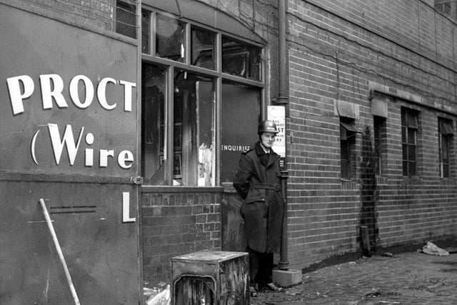 Proctor Brothers (Wireworks) factory in Wortley after a break-in and arson. The thieves had lit ten fires, burning company records, and stealing money from the safe. A policeman stands outside the enquiries office.