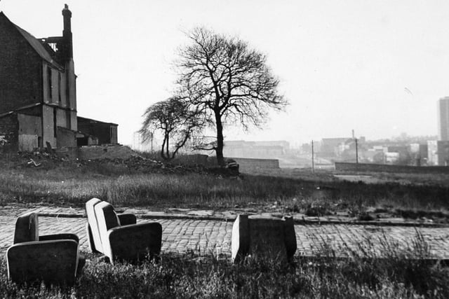 Burmantofts. A scene which might bring to mind a Bronte landscape, but for a now an abandoned three-piece suite and new flats, in the mist, to the right.