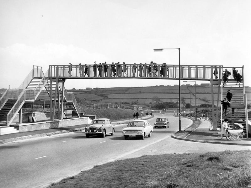 May 1967 and Priesthorpe Secondary School pupils use the new bridge which has been built for them by Pudsey Council.