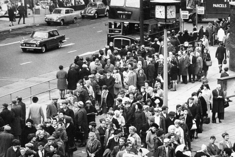 Long queues wait for buses, reduced by the overtime ban, at the junction of The Calls and Vicar Lane in October 1967.