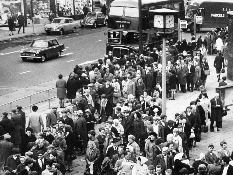 Long queues wait for buses, reduced by the overtime ban, at the junction of The Calls and Vicar Lane in October 1967.