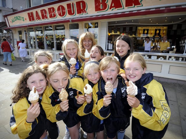 Cayton Corinthians Girls U-11 football team get their sponsored jackets, and an ice cream each, from their sponsors, the Harbour Bar, in 2010.