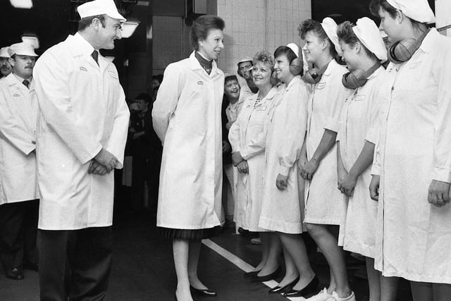 Princess Anne talking to Heinz workers during her visit escorted by factory manager Paul Sneddon in 1989.