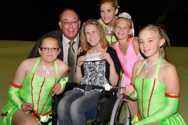 Blackpool Ice Twirlers present a cheque for over 3,000 to Elizabeth Smart who was left blind and unable to walk after a throat infection. Pictured from left to right are: Charlotte Crane, John Holden, Elizabeth Smart, Lydia Smart, Amber Banks and Jessica Kelley