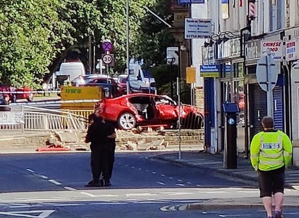 The damaged of the red BMW from Bradford Road