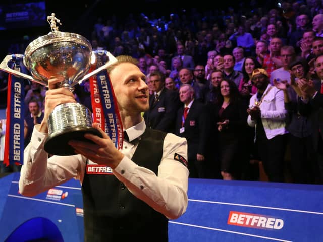 udd Trump celebrates with the trophy after winning the 2019 Betfred World Championship at The Crucible, Sheffield.  Photo credit should read: Richard Sellers/PA Wire