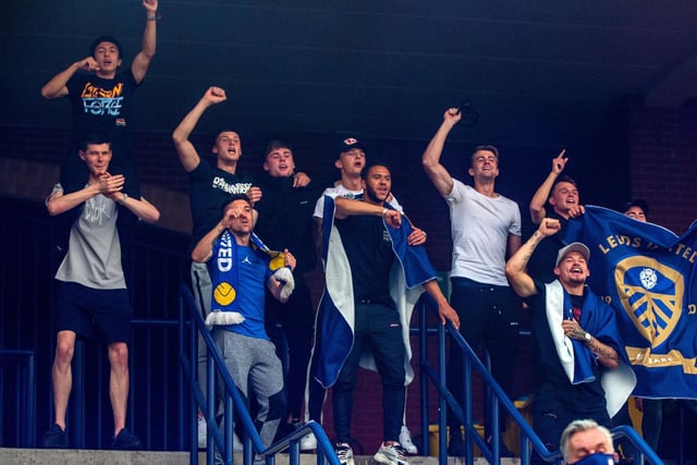 Players sing along with fans chants as Leeds United celebrate promotion to the Premier League.