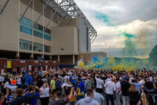 Fans sang Marching On Together and 'Leeds are going up' as they celebrated outside Elland Road.