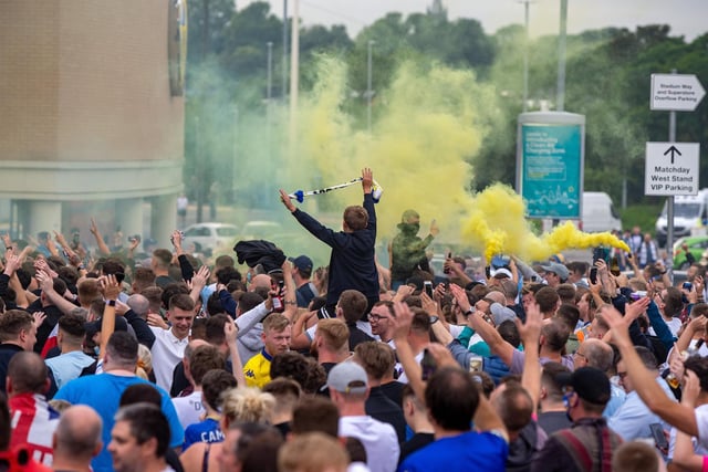 Fans gathered at Elland Road shortly after it was confirmed Leeds were back in the Premier League