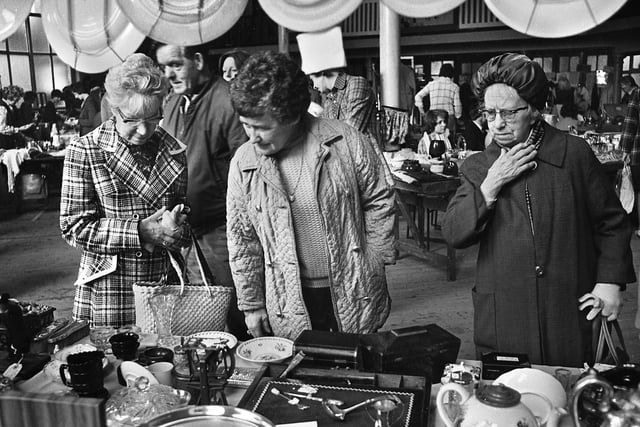 Browsing the stalls at a flea market in the Queen's Hall, Wigan, May 1975.