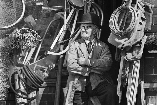 John Morris, aged 88, in the doorway of his hardware and cycle shop which he had run for 70 years in Bryn Street, Ashton, in May 1972.