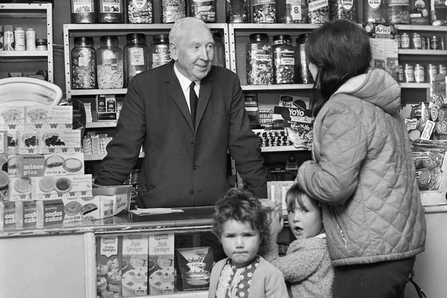 James Gaskell serving in his general stores and sweet shop on the junction of Sandy Lane and St. James Road, Orrell, in October 1971.
